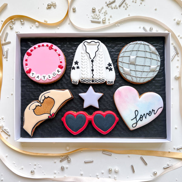 Taylor Swift biscuit gift box featuring love heart glasses and a friendship bracelet biscuit